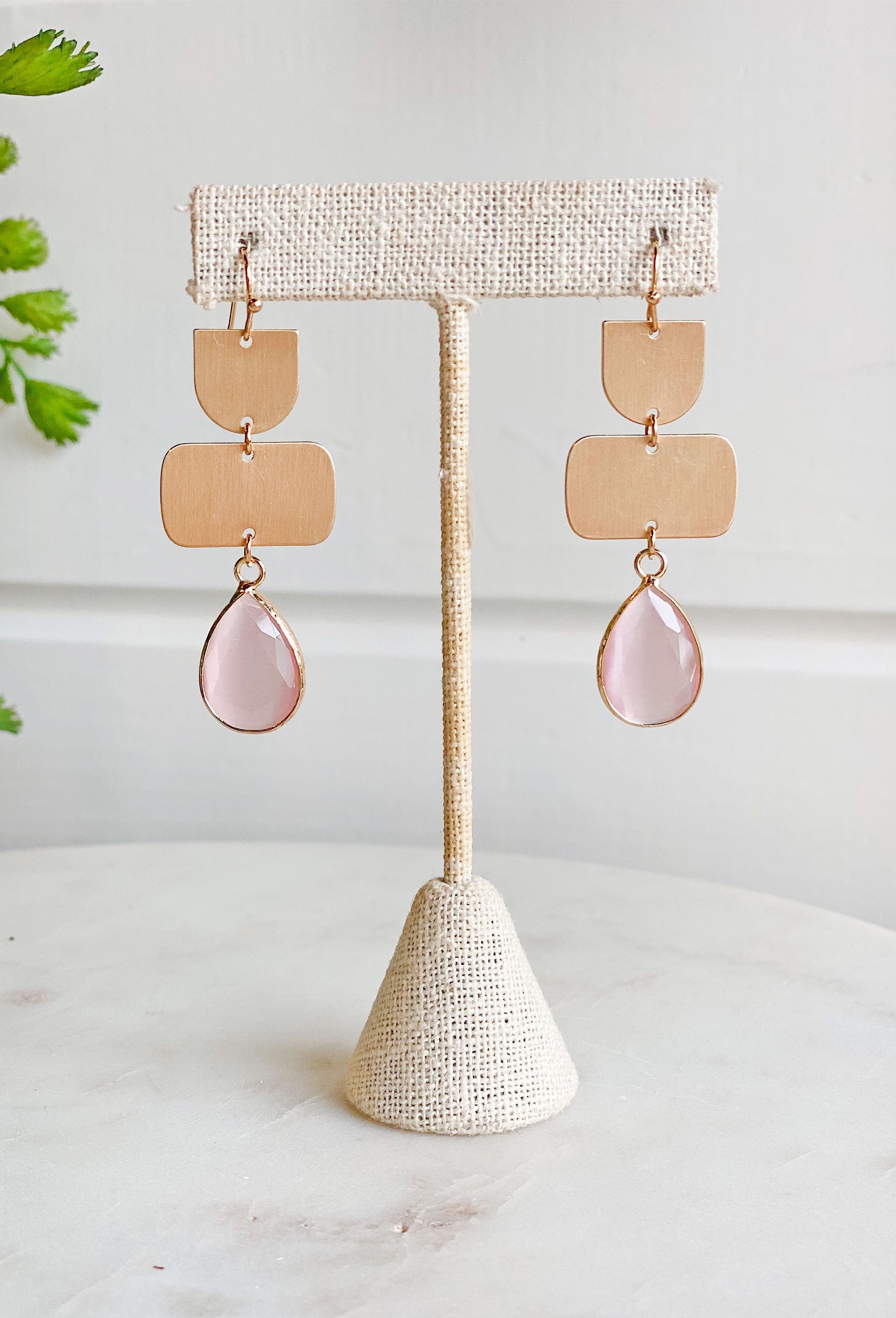 Lulu Drop Earrings in pink, gold drop earrins with pink colored gemstone in a teardrop shape