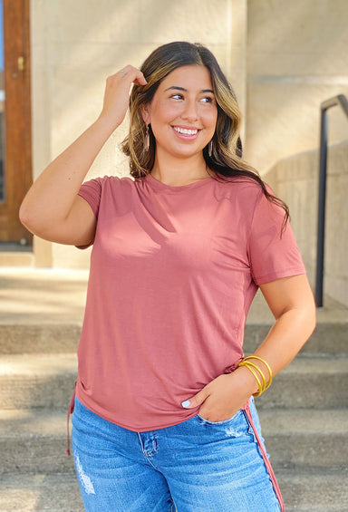 Name of the Game Ruched Top, mauve colored top, crewneckline, short sleeves, ruched detailing on either side of the top