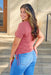 Name of the Game Ruched Top, mauve colored top, crewneckline, short sleeves, ruched detailing on either side of the top