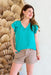 Never Settle Top in Jade, v-neck blouse with ruffle on sleeves