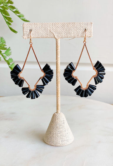 One Thing Earrings in Black, gold drop earrings with black gems fanned out on each side