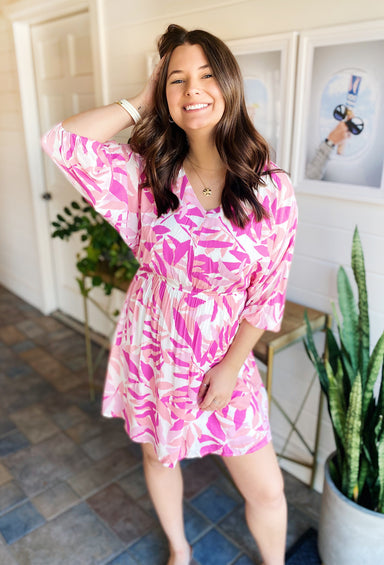 Paradise Pink Palm Dress, multiple shades of pink, flowy silhouette, v-neck, it's fully lined