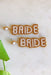 Pearl Bride Earrings, "bride" written in pearls, with a gold sparkle outline