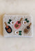 Poppin' Bottles Beaded Pouch, An ivory beaded pouch with colorful bottles, rhinestones, and floral details