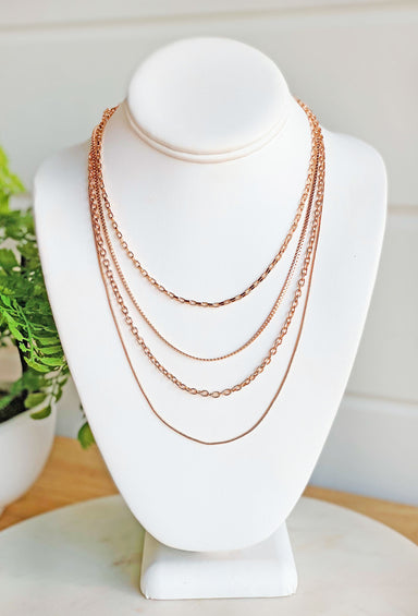 Secret's Out Necklace, layered gold necklace, 4 different chains with a lobster clasp