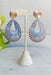 Stolen Romance Earrings in Blue, gold teardrop earrings with blue threading