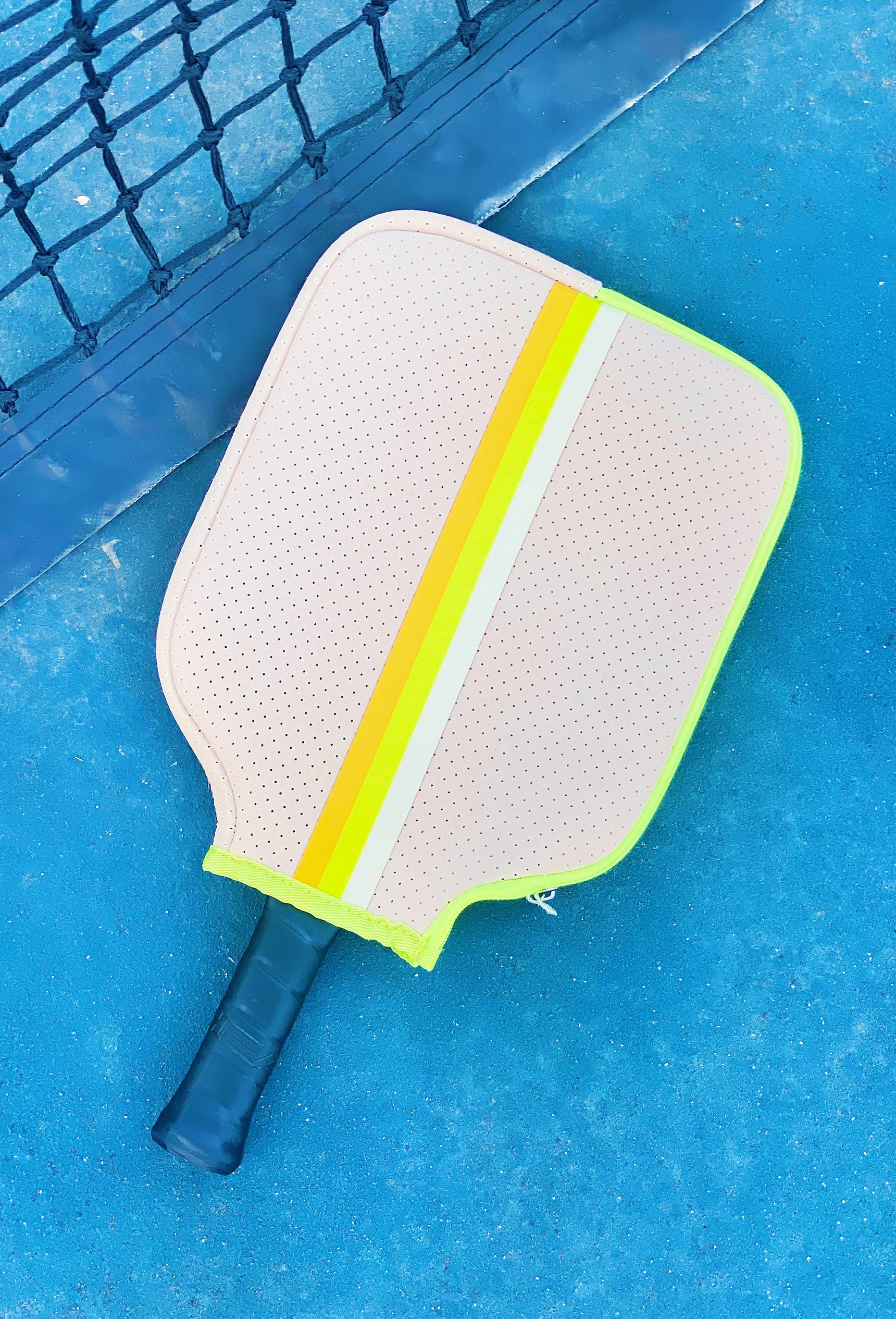The Eve Neoprene Pickleball Paddle Cover, neon yellow and orange stripe with neon yellow zipper detailing