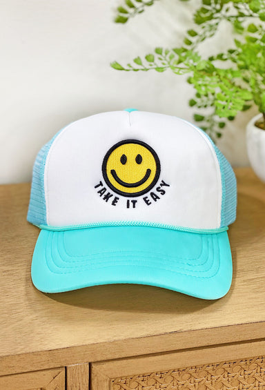 Take It Easy Trucker Hat in Turquoise, Turquoise bill and mesh backing, take it easy and yellow smiley face embroidered into the hat