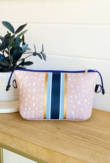 The Ann Neoprene Large Cosmetic, tan fawn print with navy blue zipper, light blue, white, navy and gold stripe down middle 