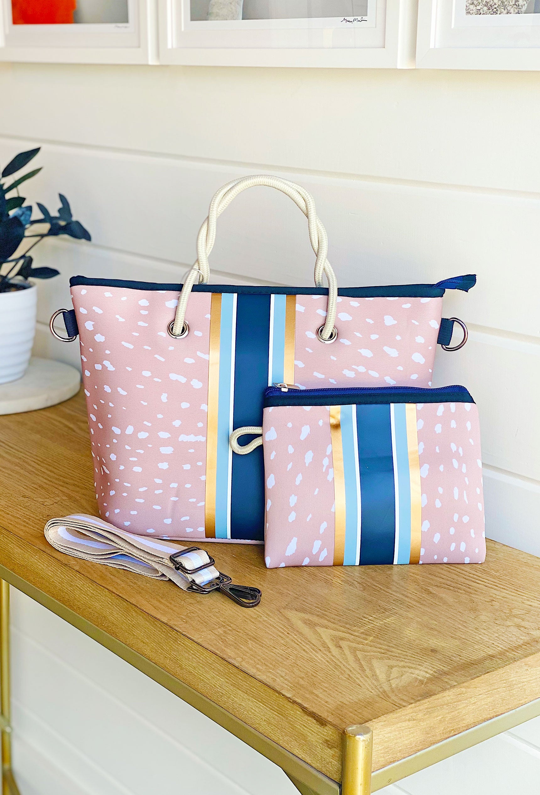 The Ann Neoprene Mini Tote, taylor gray mini tote, fawn background with blue and gold stripes, striped crossbody strap, comes with coin purse to match