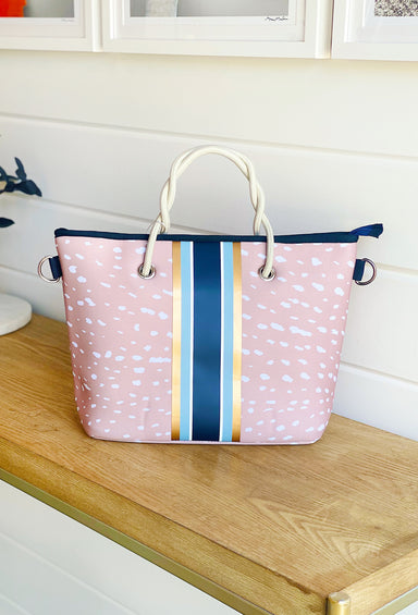 The Ann Neoprene Mini Tote, taylor gray mini tote, fawn background with blue and gold stripes, striped crossbody strap, comes with coin purse to match