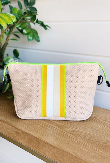 The Eve Neoprene Large Cosmetic, creme colored bag, yellow and green stripes down middle, double zipper closure