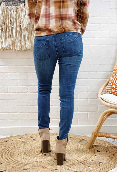 Unpublished Kora Mid Rise Skinny Jeans in Ride, medium wash skinny jean with slight distressing 