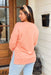 Z SUPPLY Modern V-Neck Weekender in Melon, long sleeve v-neck pullover with exaggerated slits on the side